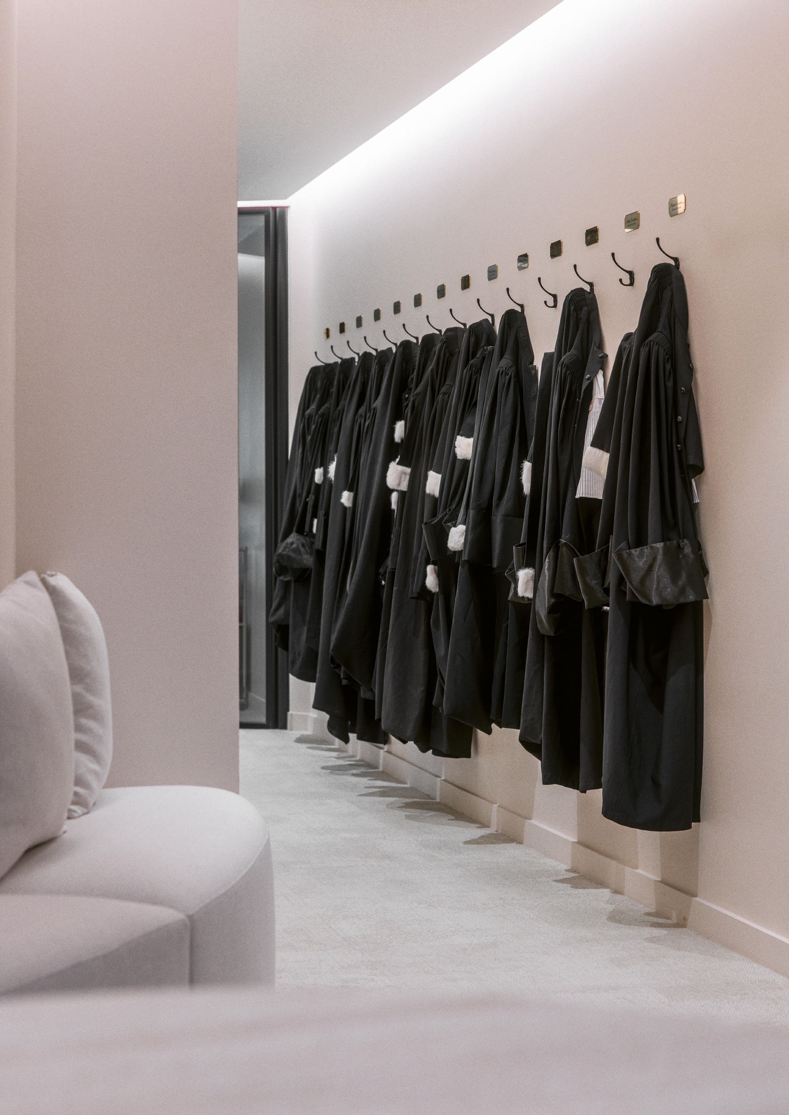 Lawyers' gowns hanging in the firm's corridor